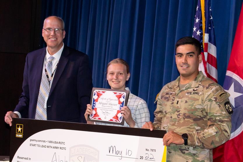 A student is honored for serving in the US Armed Forces after high school